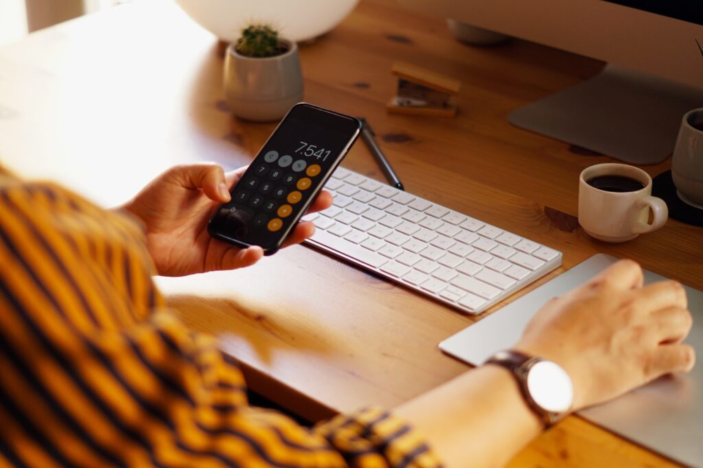 A closeup shot of an entrepreneur working from home and doing calculations