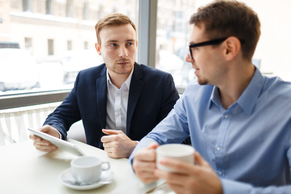 Appointment and talk of brokers in cafe